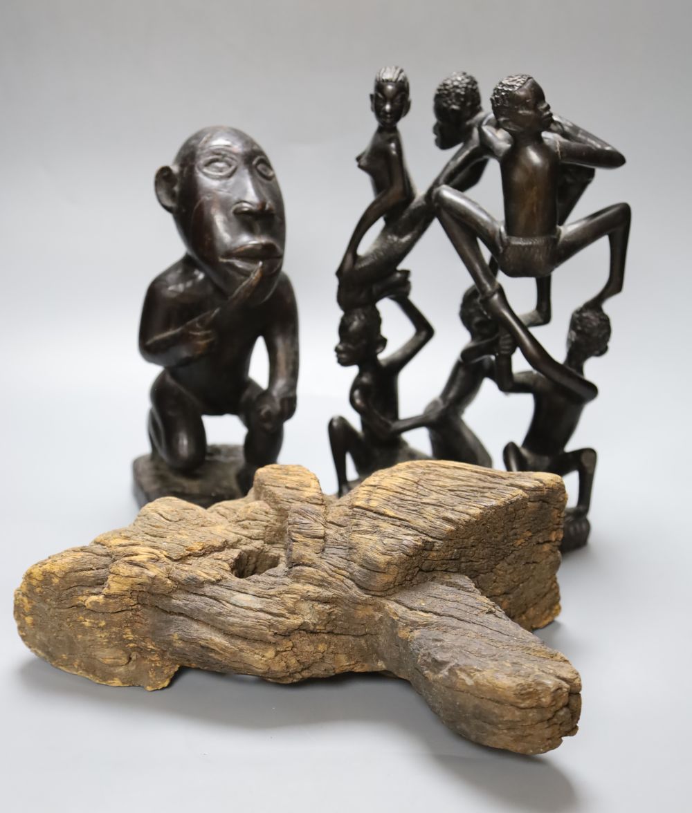 A Luba style wood kneeling figure and two other tribal carvings, tallest 29cm